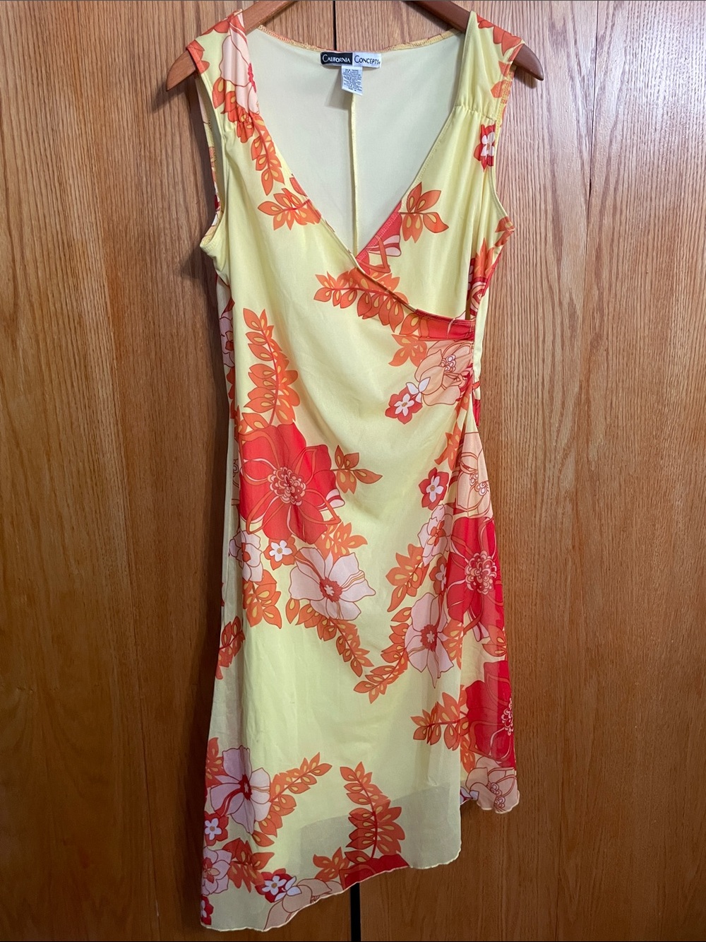 Carrera Concepts Yellow Floral Asymmetrical Wrap Dress with Orange Accents